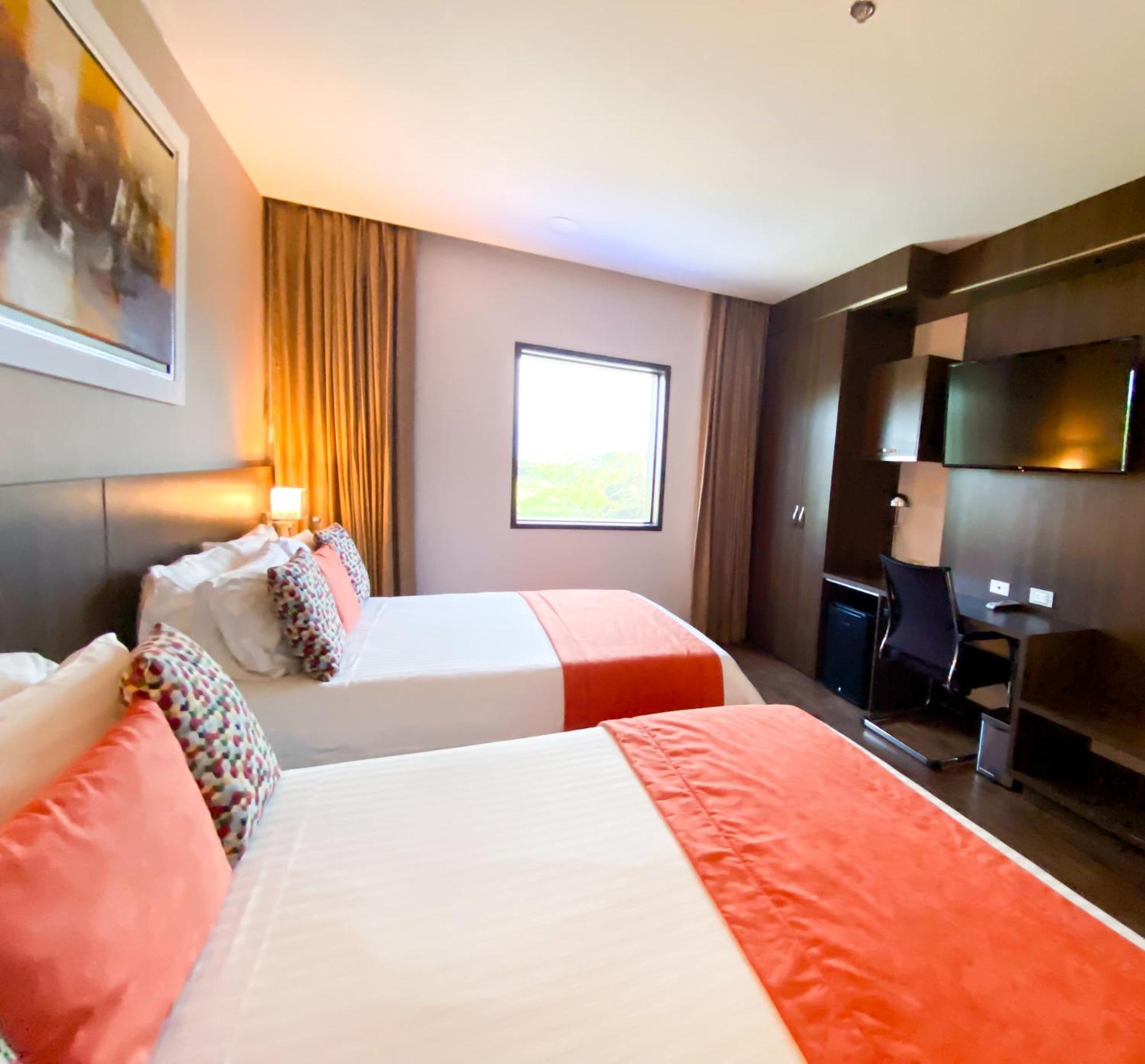 Hotel Royal Elim International Cali Bagian luar foto A room at the hotel