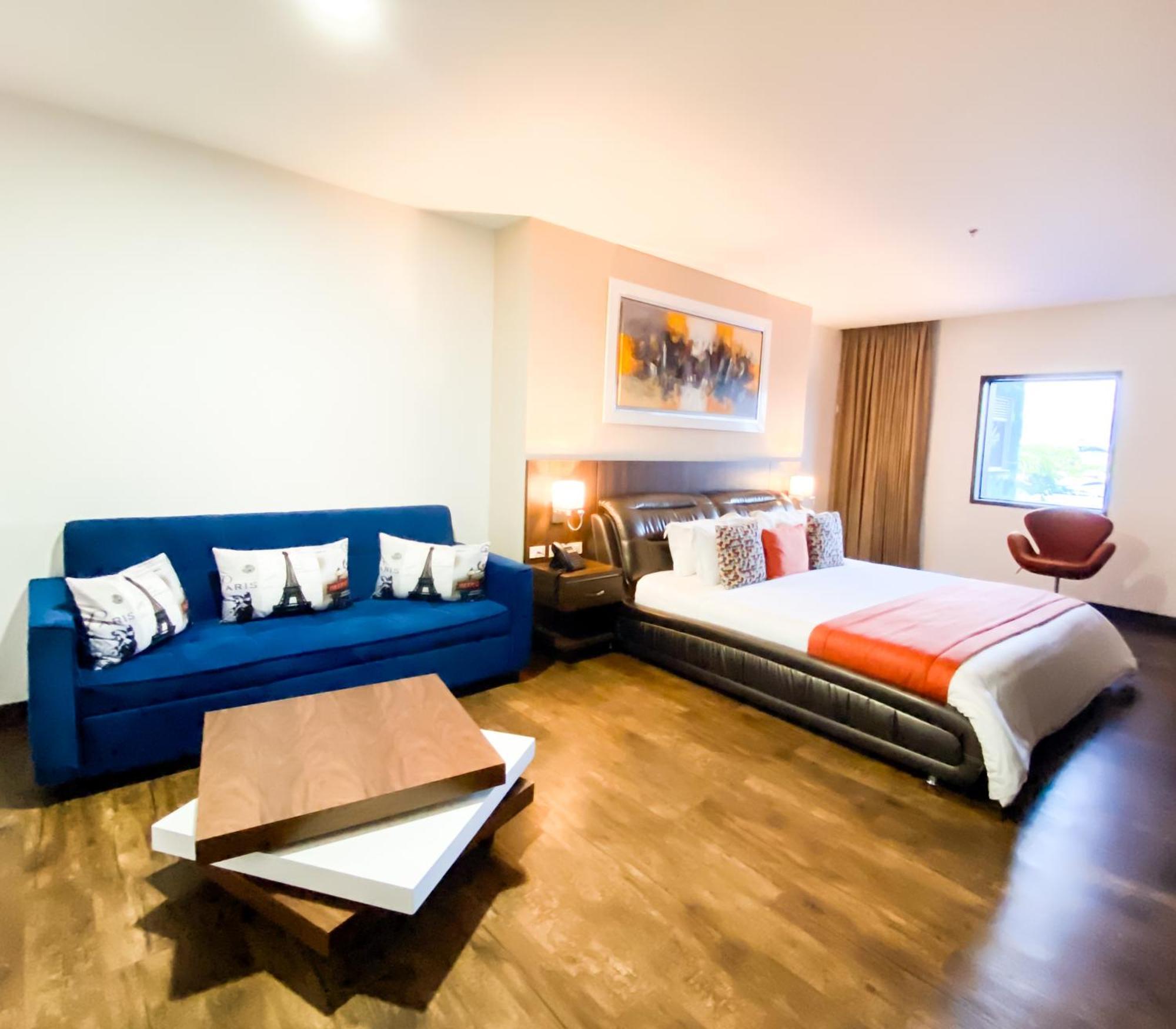 Hotel Royal Elim International Cali Bagian luar foto A room at the hotel